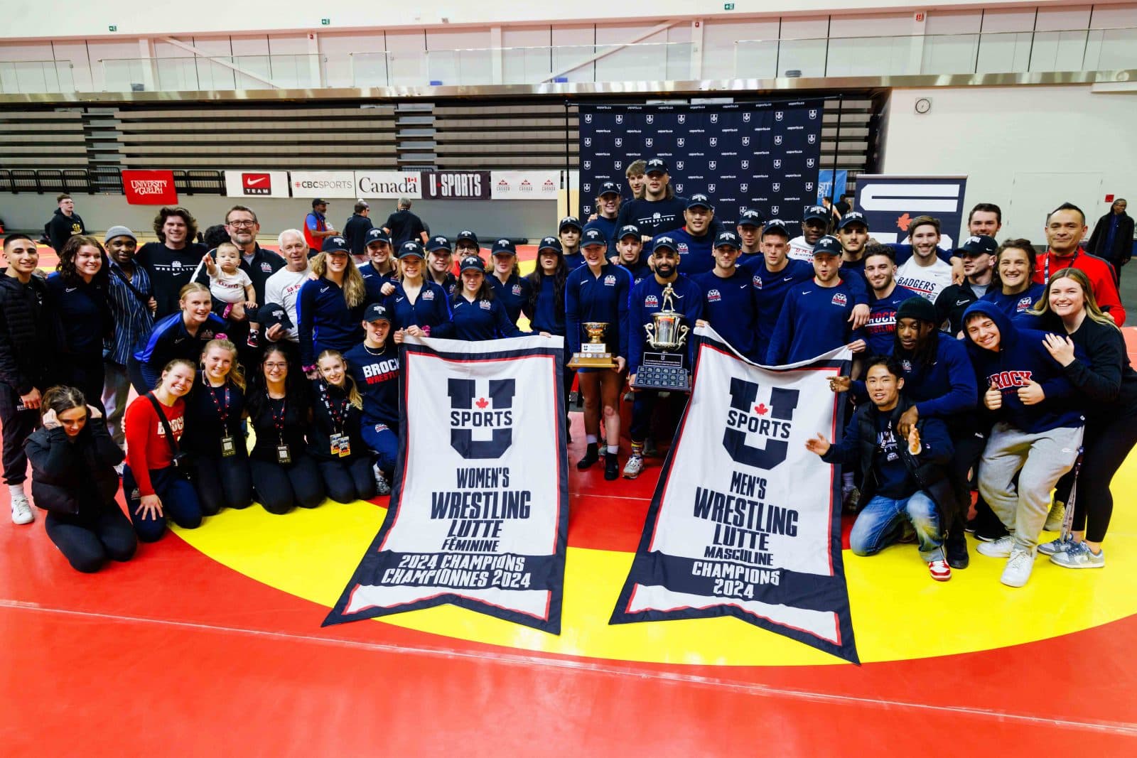 Tysen Pritchard with a varsity wrestling team during a prior sport medicine support role.